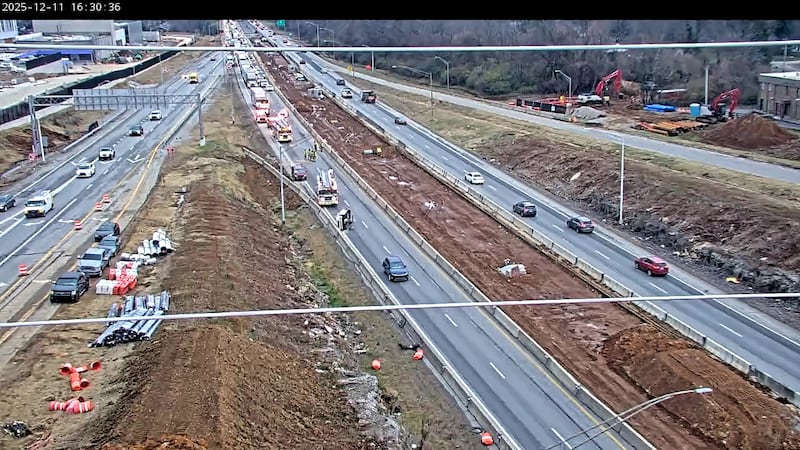 All lanes are blocked on the Watterson Expressway after a three-vehicle crash on Thursday.