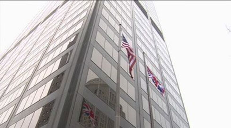 The U.S. and British flags fly outside the National City Tower in downtown Louisville.