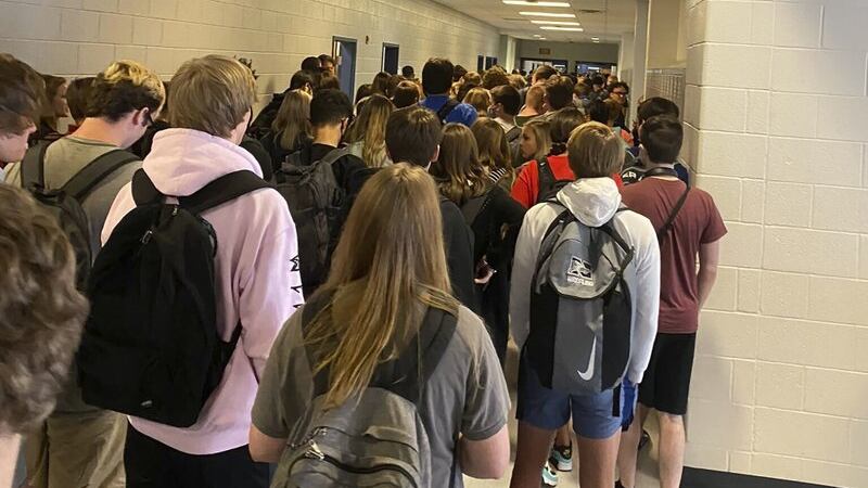 FILE - In this photo posted on Twitter, students crowd a hallway, Tuesday, Aug. 4, 2020, at...