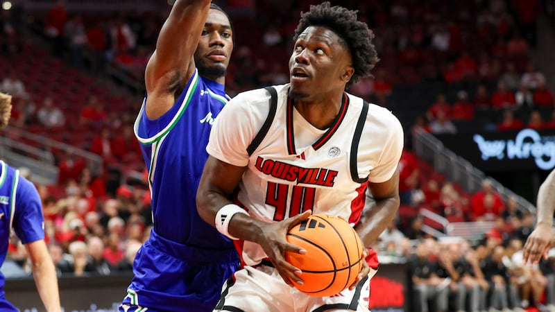 Louisville's Flory Bidunga goes up for two points in the Cardinals' exhibition victory over...