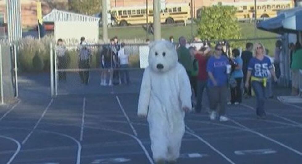 Dressed from head to toe in faux fur a soldier made his way onto a high school football field...