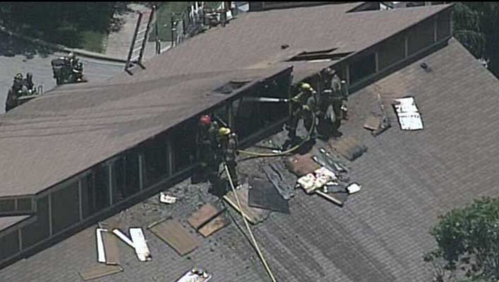 Firefighters working on the roof of the building to make sure the fire is out. (Source: Air 3,...